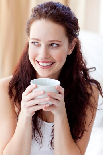 07_17_04_beautiful-woman-drinking-cup-coffee-bed_13339-60074.jpg