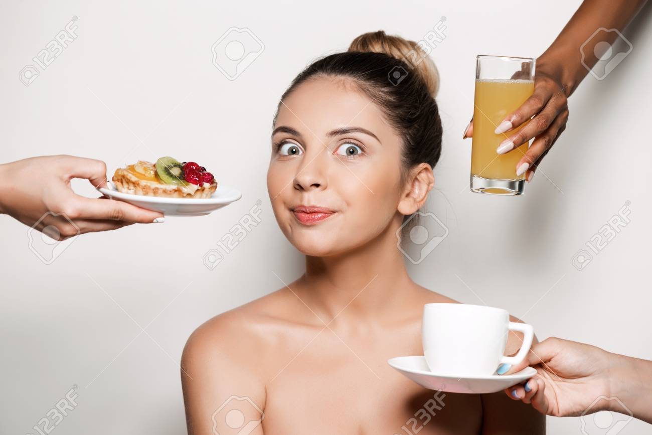 61707504-hands-offering-cake-and-drinks-to-young-beautiful-girl-in-towel-over-light-background.jpg