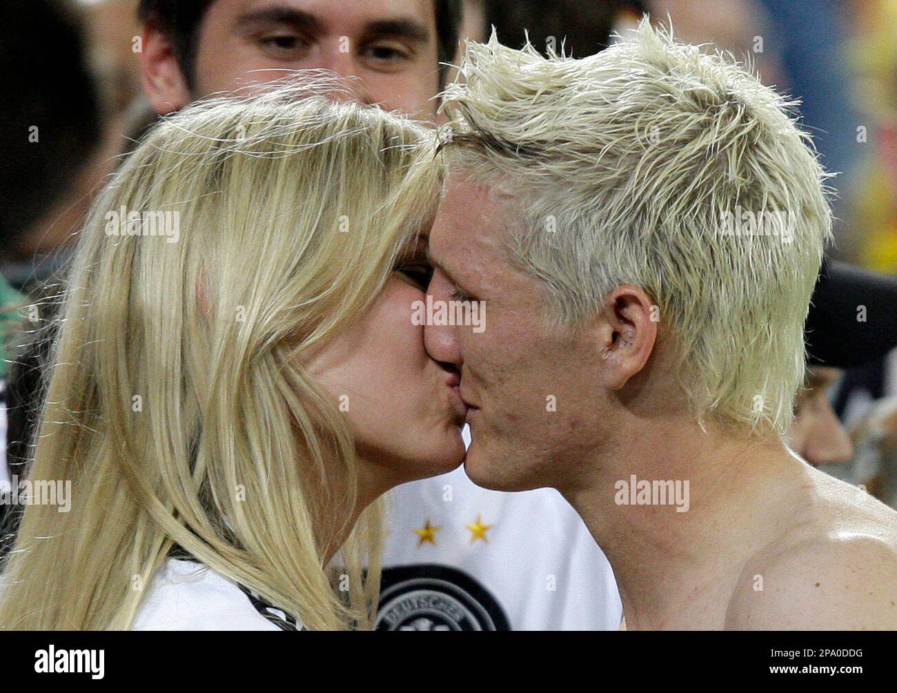 germanys-bastian-schweinsteiger-right-kisses-his-girlfriend-sarah-brandner-after-the-quarterfi...jpg